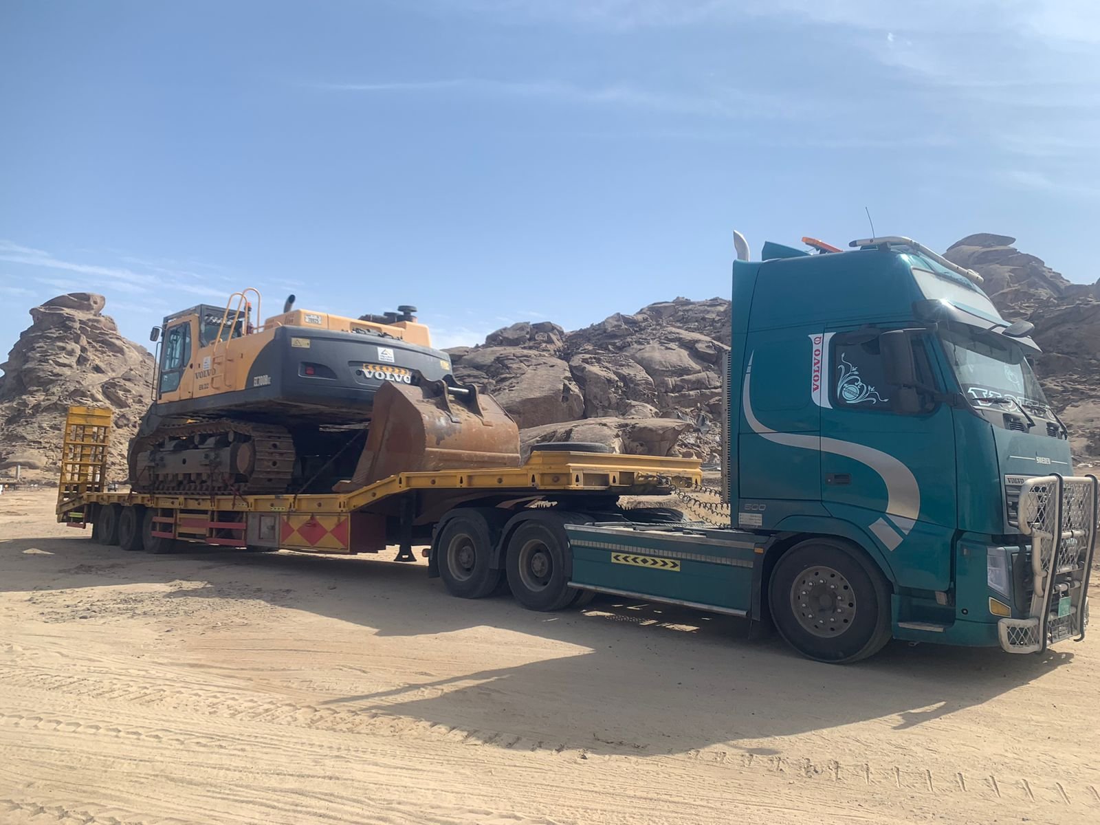 Excavator transported to a project location